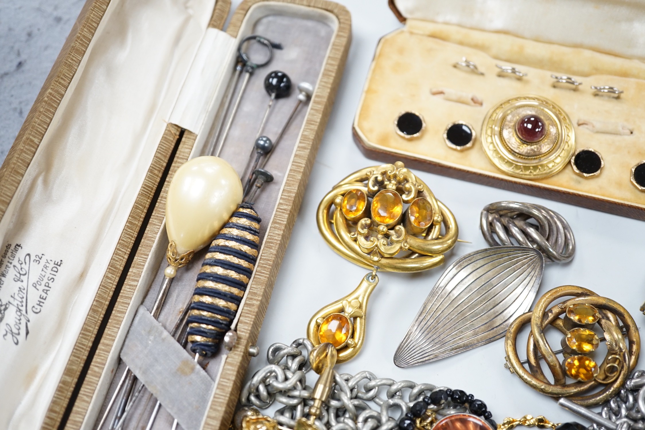 A Victorian yellow metal and cabochon garnet set brooch, with cannetlie work decoration, 34mm, a silver albert and a quantity of assorted minor costume jewellery.